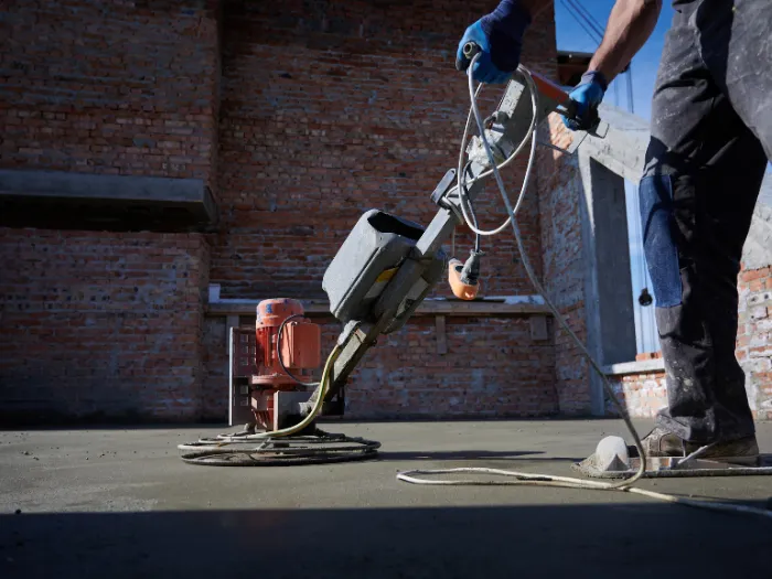 Professional concrete grinding and surface preparation using an industrial floor grinder