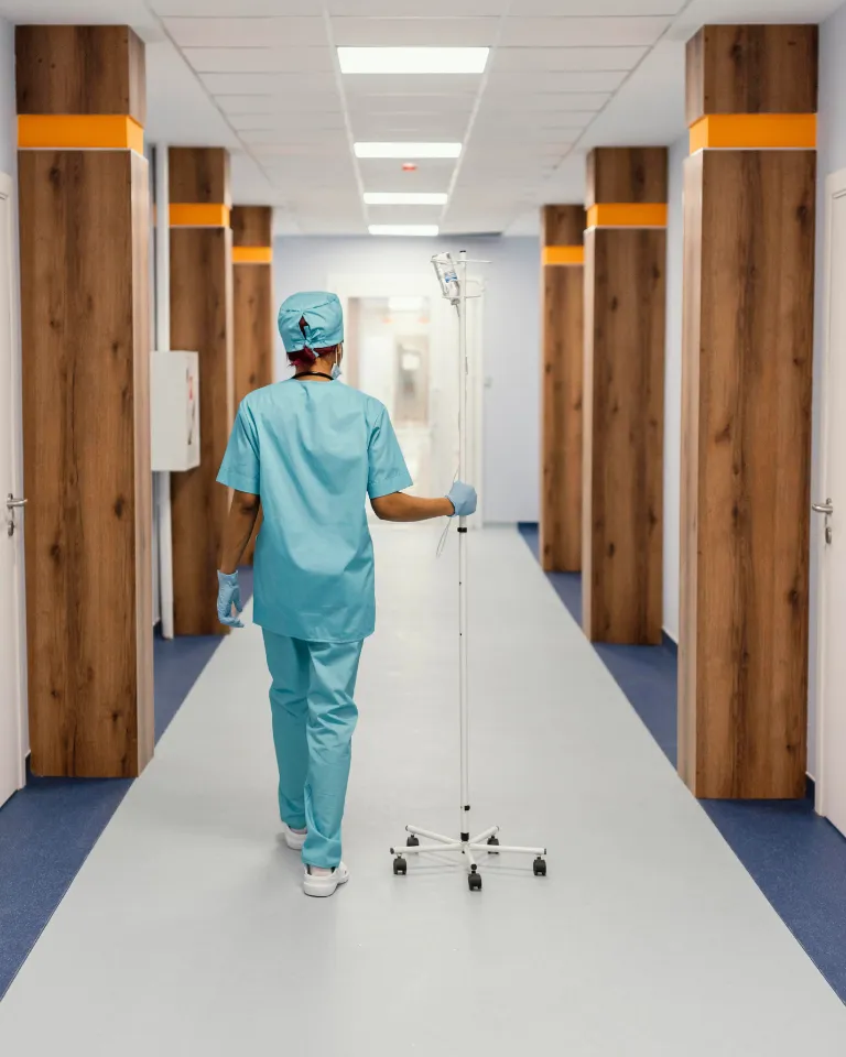 Seamless epoxy flooring in a hospital hallway with medical staff